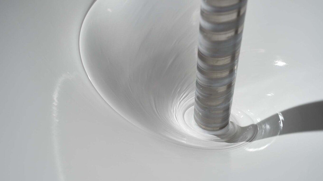 Close-up of chemicals being stirred in a machine
