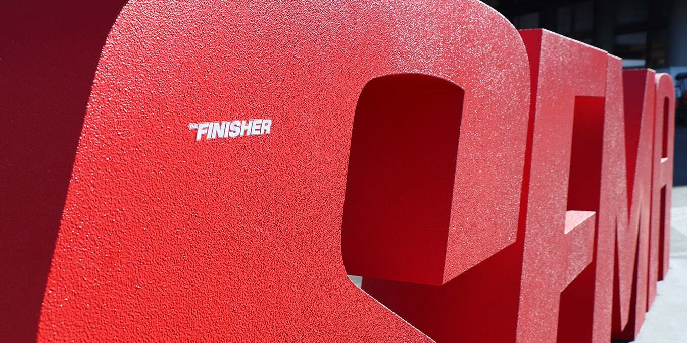 SEMA Show "The Finisher" logo sticker on the SEMA Show logo display